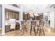 Gourmet kitchen featuring custom wood cabinetry, granite countertops, and bar seating at 16432 S Mountain Stone Trl, Phoenix, AZ 85048