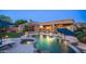 Serene backyard showcasing a pool, spa, patio, and well-maintained landscaping, ideal for leisure at 16432 S Mountain Stone Trl, Phoenix, AZ 85048
