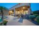 Charming back patio featuring a stone bar, ceiling fans, and easy access to the refreshing pool and outdoor space at 16432 S Mountain Stone Trl, Phoenix, AZ 85048