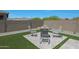 Private backyard showcasing a desert-style garden with seating area, perfect for enjoying the outdoors at 18746 W Rancho Dr, Litchfield Park, AZ 85340
