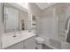Bright bathroom featuring a shower-tub combo, a single sink vanity, and modern fixtures at 18746 W Rancho Dr, Litchfield Park, AZ 85340