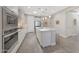 Modern kitchen with an island, stainless appliances, and neutral colors at 18746 W Rancho Dr, Litchfield Park, AZ 85340