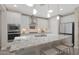 Modern kitchen featuring a large island, stainless steel appliances, and ample storage at 18746 W Rancho Dr, Litchfield Park, AZ 85340