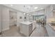 Large kitchen island overlooks the living space in this open floor plan concept at 18746 W Rancho Dr, Litchfield Park, AZ 85340
