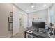 Bright office space featuring a modern desk, and a view into an ensuite bathroom at 18746 W Rancho Dr, Litchfield Park, AZ 85340
