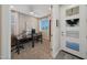 Bright and modern office space with large windows and stylish decor, leading to a white entry door at 18746 W Rancho Dr, Litchfield Park, AZ 85340