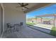 Covered patio providing a shaded retreat, perfect for outdoor dining and relaxation with easy access to the yard at 18746 W Rancho Dr, Litchfield Park, AZ 85340
