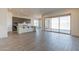 Open concept kitchen with grey cabinets, stainless steel appliances, large island, and ample counter space at 18938 W Ocotillo Rd, Waddell, AZ 85355