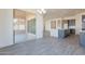 A kitchen area with sliding glass doors, an island, and gray cabinets at 18938 W Ocotillo Rd, Waddell, AZ 85355