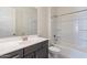 Bathroom showcasing a vanity, mirror, toilet, and shower/tub combo at 18950 W Ocotillo Rd, Waddell, AZ 85355