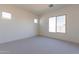 Inviting bedroom with soft carpeting and natural light from well-placed windows at 18950 W Ocotillo Rd, Waddell, AZ 85355