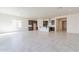 Spacious open-concept layout with a kitchen island and stainless steel appliances at 18950 W Ocotillo Rd, Waddell, AZ 85355
