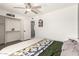 Cozy bedroom features a ceiling fan, closet with a built-in shelf, and comfortable decor at 19413 N 8Th St, Phoenix, AZ 85024