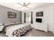 A bright bedroom features ample natural light, neutral paint, and wood-look flooring at 19413 N 8Th St, Phoenix, AZ 85024