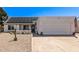 Charming single-story home with solar panels, a two-car garage, and low-maintenance desert landscaping at 19413 N 8Th St, Phoenix, AZ 85024