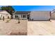 Single-story home with solar panels, a two-car garage, and low-maintenance desert landscaping at 19413 N 8Th St, Phoenix, AZ 85024