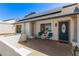 Inviting front porch featuring a seating area, lovely desert landscaping, and solar panels at 19413 N 8Th St, Phoenix, AZ 85024