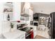 Modern kitchen featuring stainless steel appliances, white subway tile backsplash, and open layout at 19413 N 8Th St, Phoenix, AZ 85024