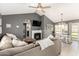 Spacious living room with a fireplace, vaulted ceilings, neutral paint, and direct access to the patio at 19413 N 8Th St, Phoenix, AZ 85024