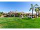 Spacious backyard featuring a well-manicured lawn and outdoor grill area, great for entertaining at 20139 E Via Del Oro --, Queen Creek, AZ 85142