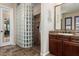 A modern bathroom with a glass block shower, stone tile and a beautiful vanity at 20139 E Via Del Oro --, Queen Creek, AZ 85142