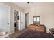 A cozy bedroom with an ensuite bath featuring a ceiling fan, closet and lots of natural light at 20139 E Via Del Oro --, Queen Creek, AZ 85142