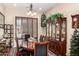 Elegant dining room with a wooden table, plush chairs, and a stylish display cabinet at 20139 E Via Del Oro --, Queen Creek, AZ 85142