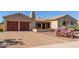 Lovely property featuring a brick driveway leading to a two-car garage with decorative doors at 20139 E Via Del Oro --, Queen Creek, AZ 85142