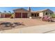 Lovely property featuring a brick driveway leading to a two-car garage with decorative doors at 20139 E Via Del Oro --, Queen Creek, AZ 85142
