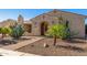 Inviting home with desert landscaping featuring a variety of cactus and stone walkway at 20139 E Via Del Oro --, Queen Creek, AZ 85142