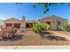 Charming home with desert landscaping, including cacti and gravel, complemented by a stone walkway at 20139 E Via Del Oro --, Queen Creek, AZ 85142