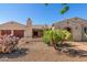 Charming home with desert landscaping, including cacti and gravel, complemented by a stone walkway at 20139 E Via Del Oro --, Queen Creek, AZ 85142