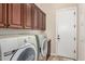 Functional laundry room with appliances and cabinetry for storage at 20139 E Via Del Oro --, Queen Creek, AZ 85142