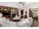 Inviting living room with stone fireplace, built-ins, and comfortable seating creating an ideal gathering space at 20139 E Via Del Oro --, Queen Creek, AZ 85142