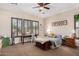 Bright main bedroom with neutral tones, shuttered windows, and comfortable furnishings creating a relaxing retreat at 20139 E Via Del Oro --, Queen Creek, AZ 85142