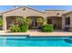Inviting pool area with lush tropical landscaping at 20139 E Via Del Oro --, Queen Creek, AZ 85142