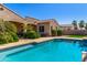Private backyard pool, nestled between the home and lush landscaping, perfect for serene relaxation at 20139 E Via Del Oro --, Queen Creek, AZ 85142