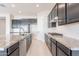 Open kitchen with granite countertops, stainless appliances and plenty of cabinet space at 20234 W Catalina Dr, Buckeye, AZ 85396