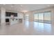 Open concept living space with tile flooring, dark cabinets, and lots of natural light at 20234 W Catalina Dr, Buckeye, AZ 85396