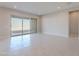 Bright living room featuring sliding glass doors to the backyard, creating an indoor/outdoor flow at 20234 W Catalina Dr, Buckeye, AZ 85396