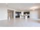 Spacious living area with tile flooring and seamless access to the gourmet kitchen at 20234 W Catalina Dr, Buckeye, AZ 85396