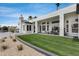 Backyard with a lawn and patio that offers the perfect blend of relaxation and recreation at 21663 N 57Th Ave, Glendale, AZ 85308