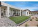 A backyard with a patio and grassy area is perfect for outdoor entertaining and relaxation at 21663 N 57Th Ave, Glendale, AZ 85308