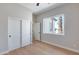 Bedroom with hardwood floors, a window view, and closet space at 21663 N 57Th Ave, Glendale, AZ 85308