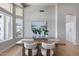 Dining room boasting natural light from many windows and neutral decor at 21663 N 57Th Ave, Glendale, AZ 85308