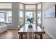 Bright dining area with large windows providing natural light and waterfront views at 21663 N 57Th Ave, Glendale, AZ 85308