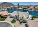 Stunning waterfront home featuring a private pool, lush landscaping, and a three-car garage at 21663 N 57Th Ave, Glendale, AZ 85308
