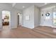 Elegant foyer with hardwood floors, arched doorways, and natural light at 21663 N 57Th Ave, Glendale, AZ 85308
