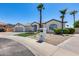 Home with a three-car garage, desert landscaping, and a decorative mailbox at 21663 N 57Th Ave, Glendale, AZ 85308