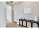Hallway featuring a stylish black cabinet with decorative vases, creating an inviting entrance at 21663 N 57Th Ave, Glendale, AZ 85308